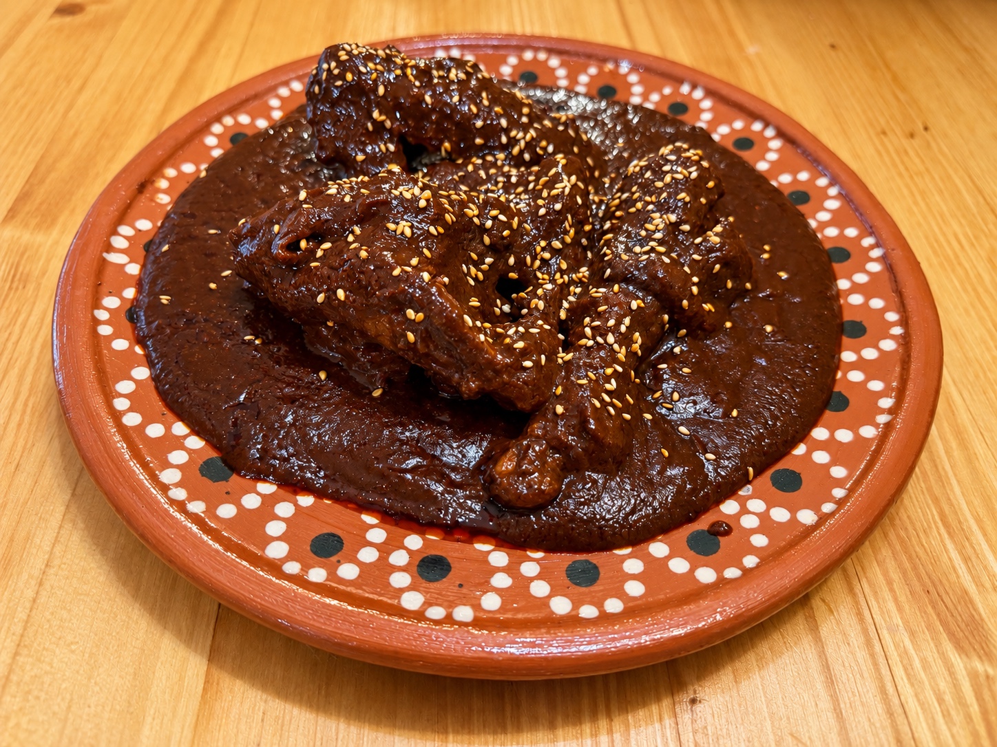 Mole poblano on a terracotta plate